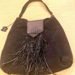 Boho oversized tassel handbag , great but really oversized.,Genuine leather.